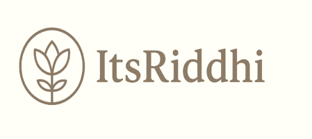 “ItsRiddhi logo featuring a minimalist lotus icon and calm typography in taupe brown on a soft neutral background.”